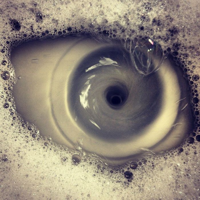 Out Of Boredom, I Tried To Take A Photo Of A My Sink Draining, I Got A Photo Of An Eye Shaped Whirlpool Instead